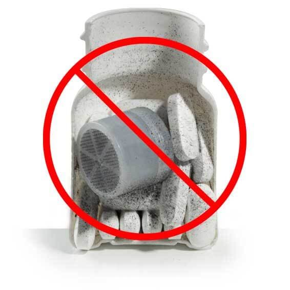Moisture-control canister and tablets inside a dusty bottle.